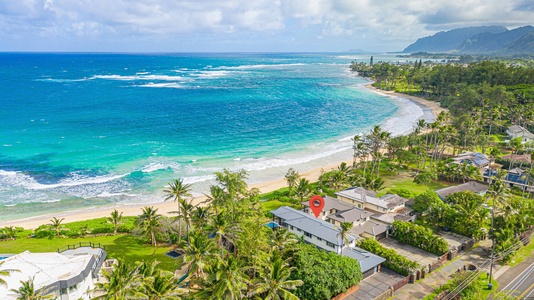 A stunning aerial view showcasing the turquoise waters and sandy beaches of this tropical getaway.