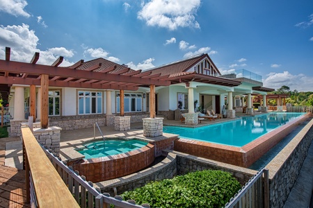 Luxurious estate living with a hot tub and spacious lanai area at Kailua Kona Estate.