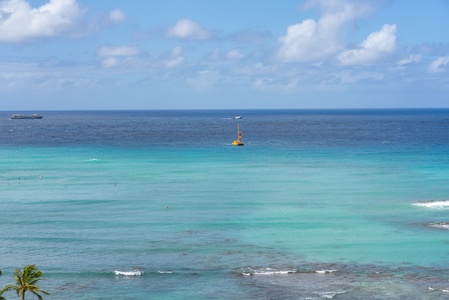 Vibrant turquoise waters stretching into the horizon—perfect for water activities or relaxing by the shore.