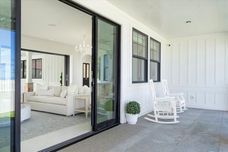 Enjoy the ocean breeze from your private covered lanai with rocking chairs and garden views.