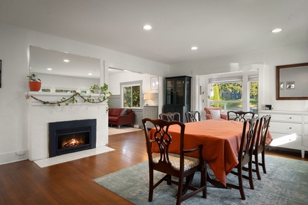 Gather around the dining table beside the fireplace after a day exploring Bellingham.