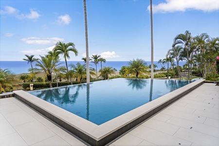 Iconic Big Island living: an infinity pool, palms, and uninterrupted Pacific views.