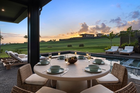 Enjoy alfresco dining at golden hour, surrounded by lush golf greens and the soft glow of a Kaua‘i sunset.