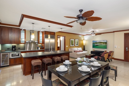 The kitchen with stainless steel appliances and island breezes from the lanai.