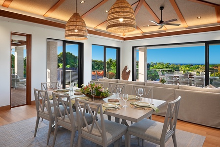 Savor breathtaking sunset dinners on the outdoor dining lanai with comfortable seating good for eight.