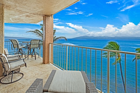 The spacious lanai at Royal Kahana 610 offers stunning ocean views, perfect for lounging or dining outdoors.