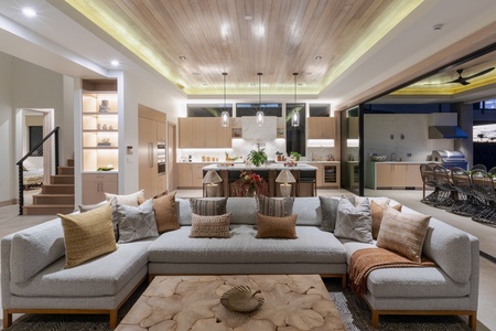 This inviting living area seamlessly integrates with an open-concept kitchen.