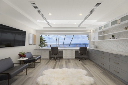 Dedicated office with ocean views and large desk, making remote work feel inspiring and effortless.