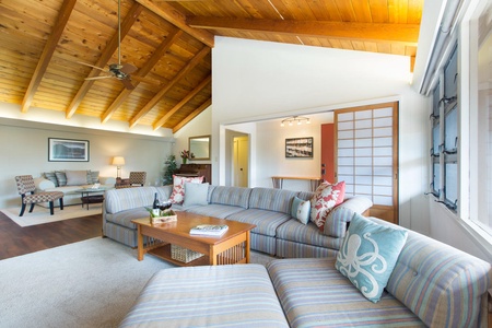 Large open-concept living room with apple TV.