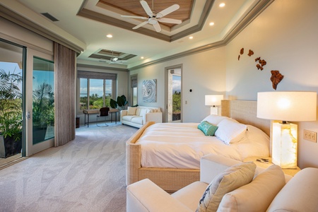 Primary bedroom retreat with lounge seating and private lanai access for peaceful mornings.