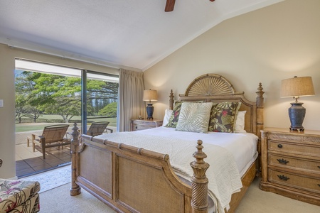 The guest bedroom features a king-size bed and lanai access with unforgettable golf course views.