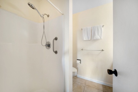 Rinse off after beach days in this clean, functional shower—perfect for transitioning from sand to sofa.