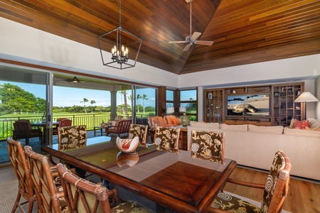 Gather around this stunning dining table while warm wood ceilings frame panoramic views of lush golf course greens.