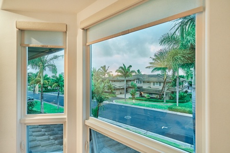 Tropical neighborhood views through your windows showcase palm-lined streets and charming homes.