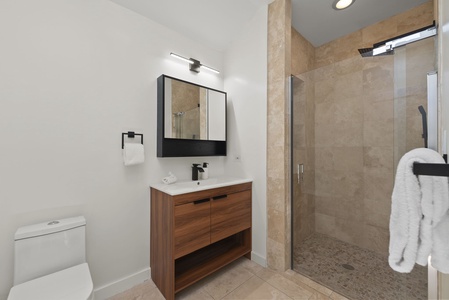Elegant bathroom with walk-in shower and modern finishes for a spa-like retreat.