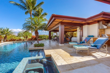 Tropical poolside retreat with comfortable loungers and serene ambiance.