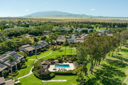 Enjoy a serene environment with meticulously maintained grounds, tropical trees, and sweeping golf course vistas.
