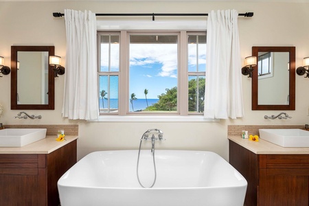 Luxurious bath with an ocean view, perfect for serene relaxation.