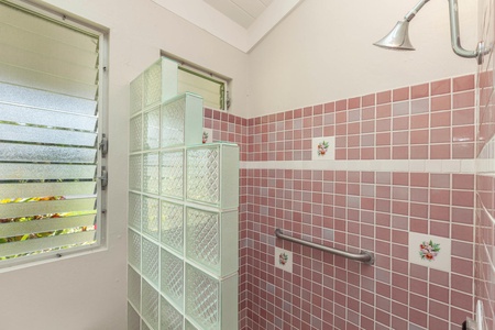 Tiled shower in shared bathroom