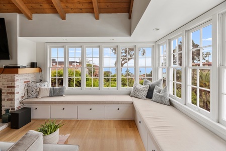 Living room with window seats and ocean view is just a dream!