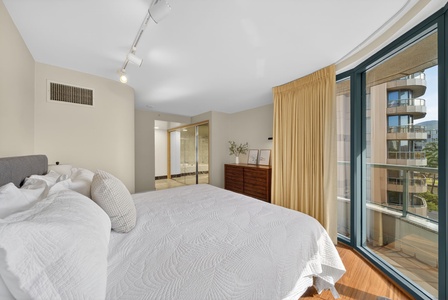 Breathe easy in this airy bedroom with lanai access and soft morning light throughout.