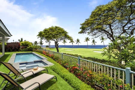 Relax poolside with stunning views of tropical landscaping and the ocean horizon.