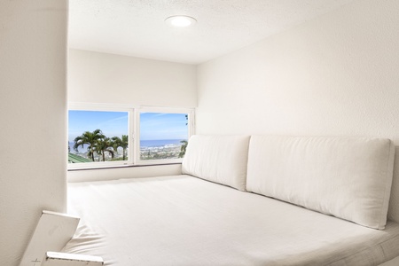 Cozy reading and lounging nook in the keiki room