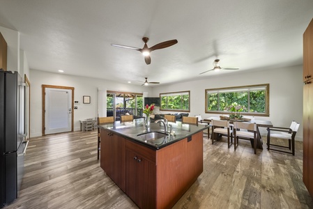 Bright, open layout uniting kitchen, dining, and living areas for seamless group connection.