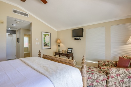The guest bedroom features a king-size bed, TV, central AC and lanai access.