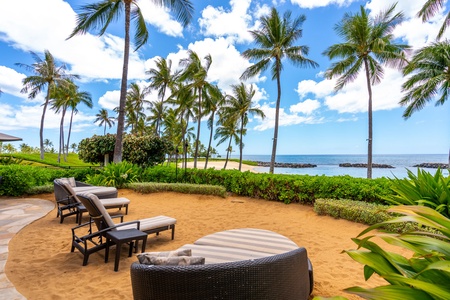 Beachfront paradise awaits with swaying palms and pristine sand just steps from your private terrace seating.