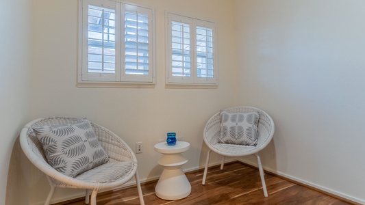 Bring your favorite book upstairs and relax on island time is this cozy seating area.