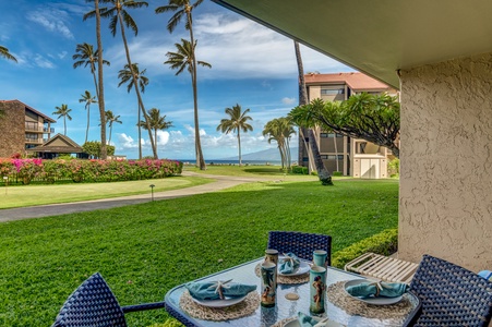 Enjoy outdoor dining with this scenic ocean view from the lanai, just steps from the beach