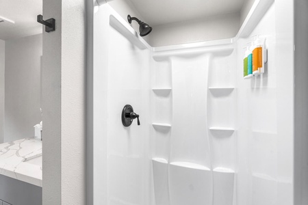 Walk-in shower for a refreshing rinse after beach days.
