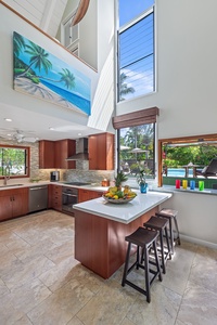Pool House chef’s kitchen and bar with modern appliances and a breakfast counter seating 3.