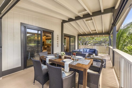 Upstairs lanai with barbecue grill and dining area, perfect for lounging.