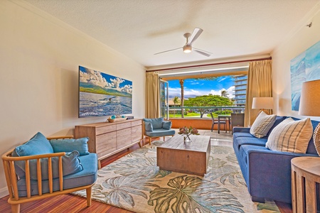 Comfortable living space at Honua Kai Konea 206 opens to a furnished lanai.