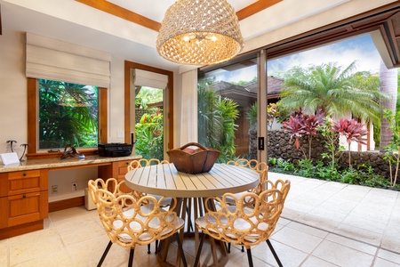 Bright & cheerful breakfast table alongside lush landscaping