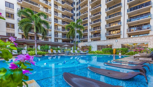 The pool with relaxing water loungers.