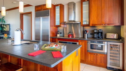 The fully equipped kitchen with stainless steel appliances.