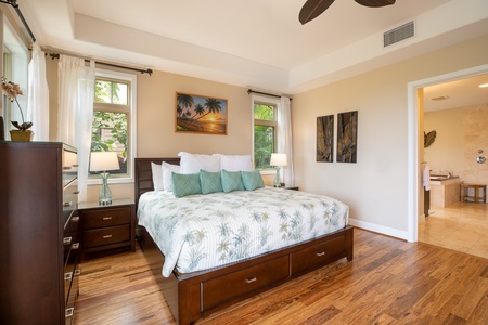 Primary bedroom with king bed and ensuite bathroom