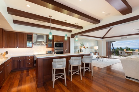 Gourmet kitchen with top tier appliances and bar seating