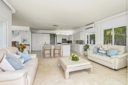 Entertain with ease in the gourmet kitchen—featuring premium appliances, marble counters, and an expansive island ideal for prepping or gathering.