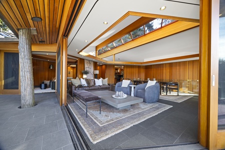 Expansive covered patio with comfortable seating and open-air design.