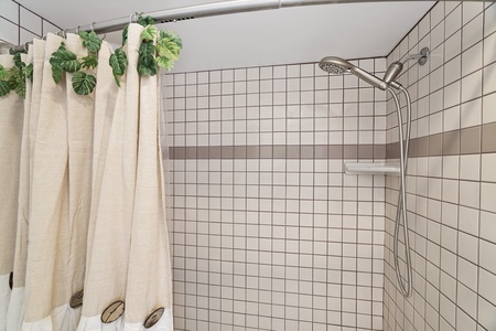Private walk-in shower in Room 2’s ensuite bathroom.
