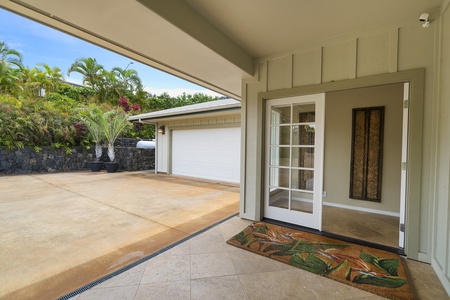 Shaded entry with tile accents offers a cool, welcoming space to come and go with ease.