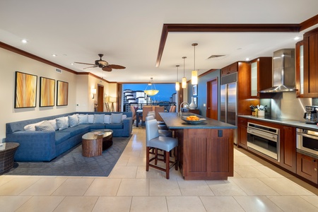 The living area and kitchen with bar seating.