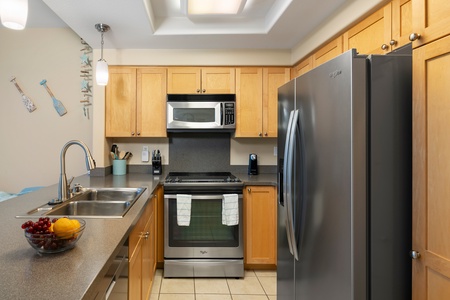Preparing meals is a breeze in the fully-stocked kitchen with stainless steel appliances and ample counter space.