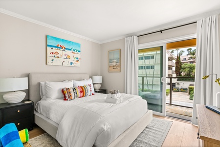 The guest bedroom with direct balcony access—enjoy fresh ocean air and morning sunshine.