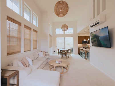 Bright, airy living room with vaulted ceilings—ideal for movie nights or lounging with loved ones.