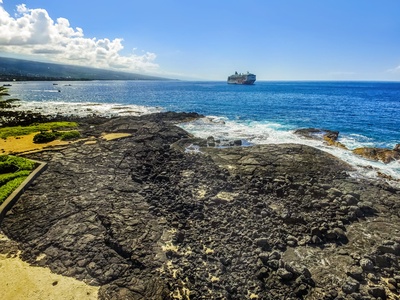 Dramatic lava shoreline and wide blue horizon—watch boats and cruise ships pass from your lanai.